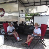 Master chef Will and his assistant Jason Williams taking a break during the cooking. They'd been at the Community Center since 8pm the night before, put the butts on to cook at midnight, and stayed up all night tending to the pork.